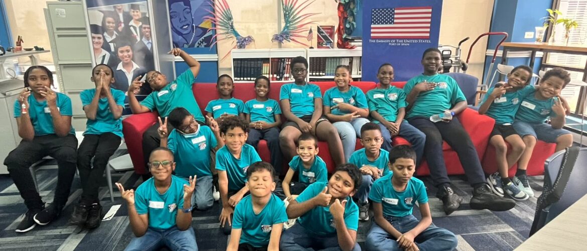Students at Rent My Tutor STEM Academy's Cycle 1 STEM Robotics Summer Camp 2026 smile and give thumbs up while participating in hands-on STEM learning at the American Center, U.S. Embassy, St. Clair, Trinidad and Tobago.